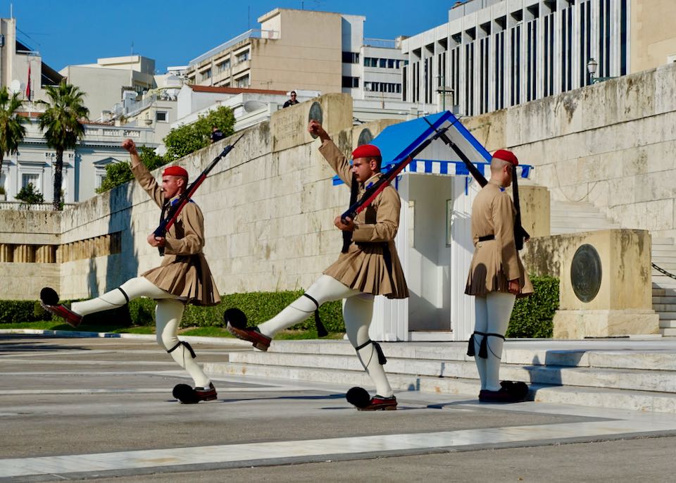 Traditional Greek military guards marching with arms and legs outstretched