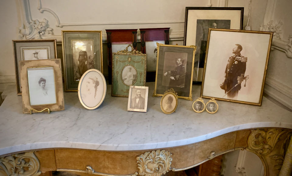 Old family photos displayed on an end table