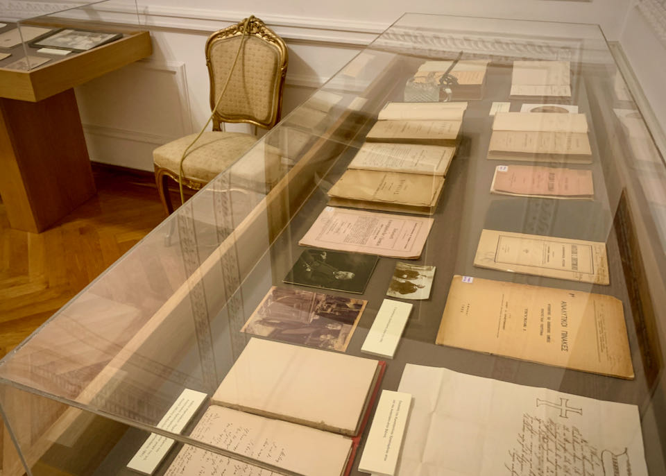 Antique documents on display in a museum case