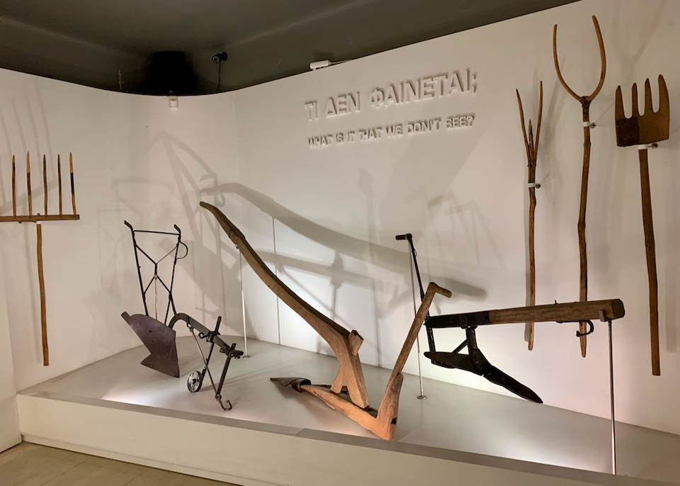 Farming implements displayed in a museum gallery
