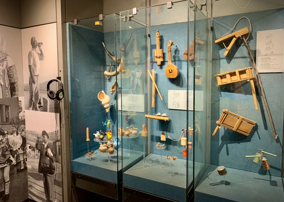 Primitive and children's instruments in a museum display case