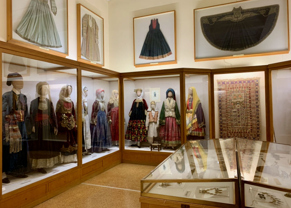 Museum room displaying traditional Greek clothing