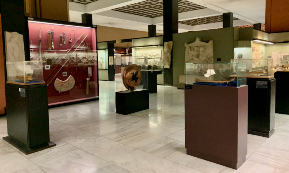 Military artifacts displayed in museum cases
