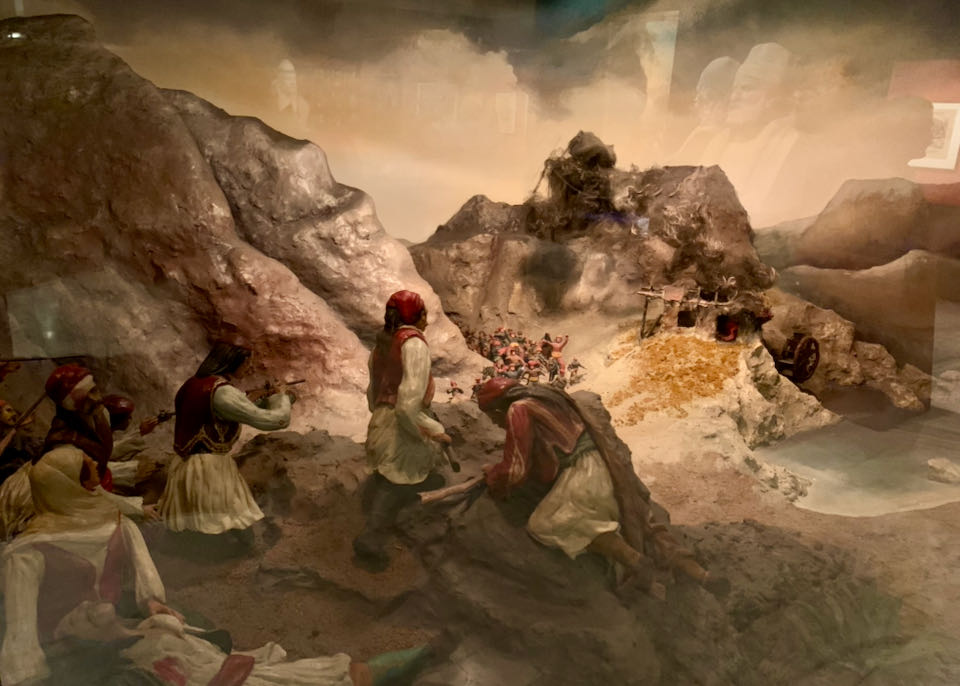 Diorama of Greek military conflict in a mountainous region