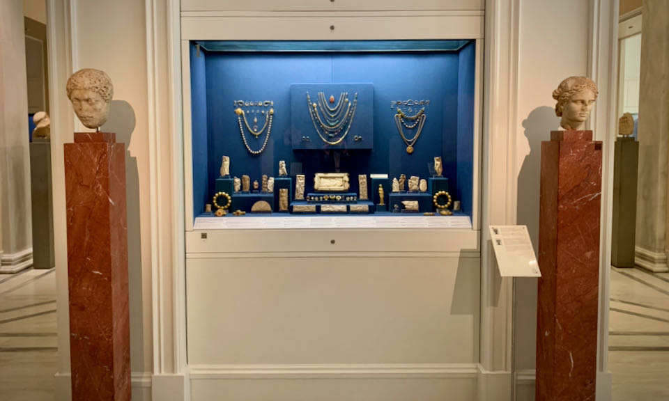 Jewelry displayed in a museum case