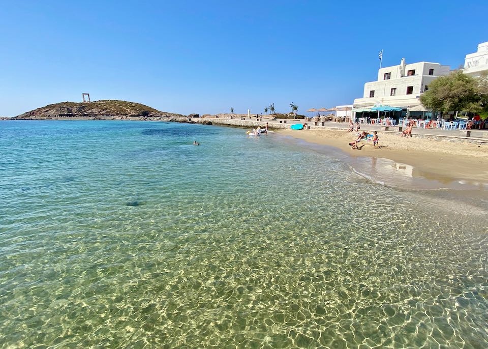 Beach and landmark in Naxos Town.