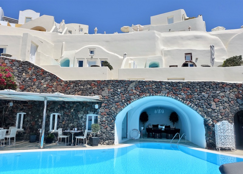 Pool and cave table at Canaves Oia Suites in Santorini
