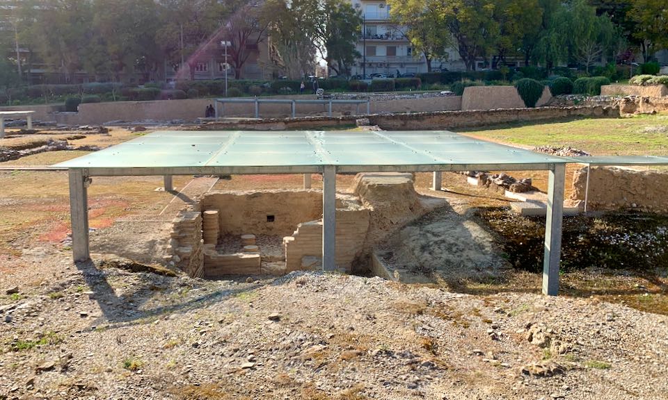 Archaeological dig area covered by a glass roof