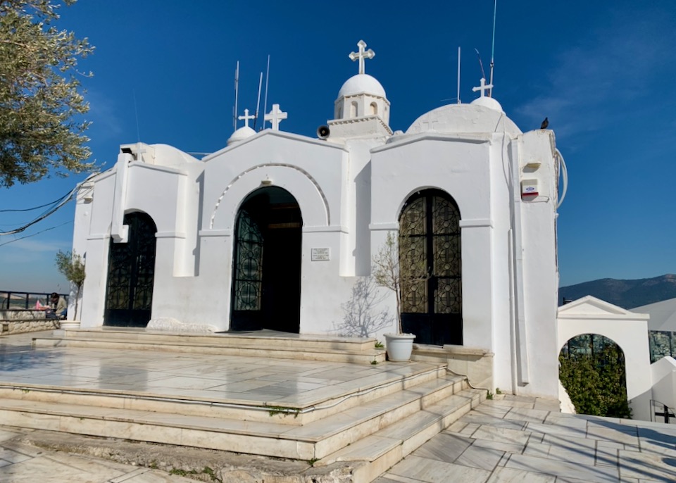 White domed Greek church against a blue sky 