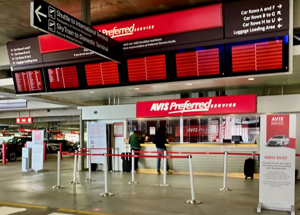 Avis garage counter and display screen with location of cars.