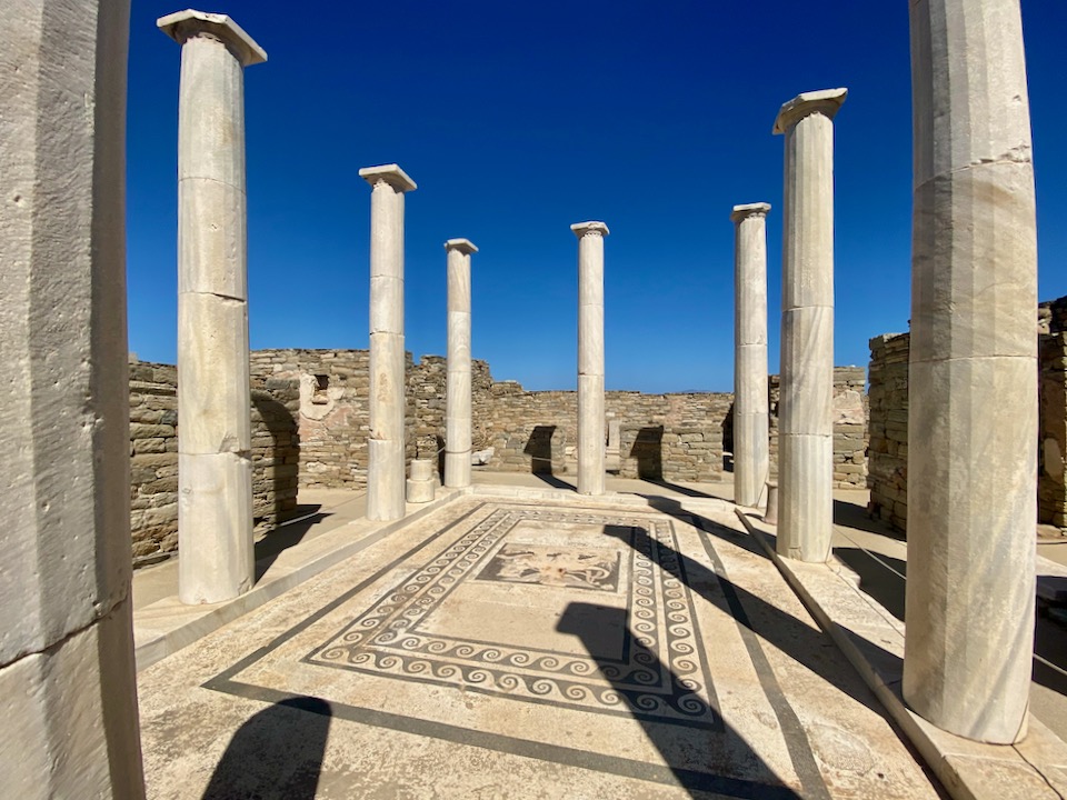 STone pillars set around a patterened mosaic floor