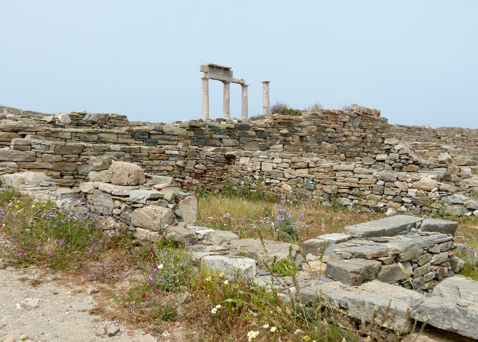 Stone ruins amid wildflowers