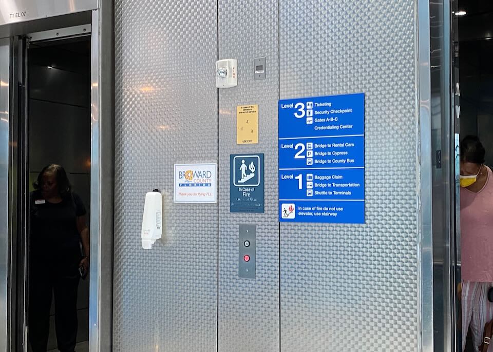 Outside the elevator, there is a sign explaining what is on levels 1 through 3.