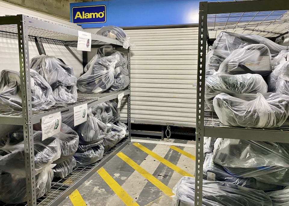 In the Alamo area, infant seats sit piled on plastic shelves.