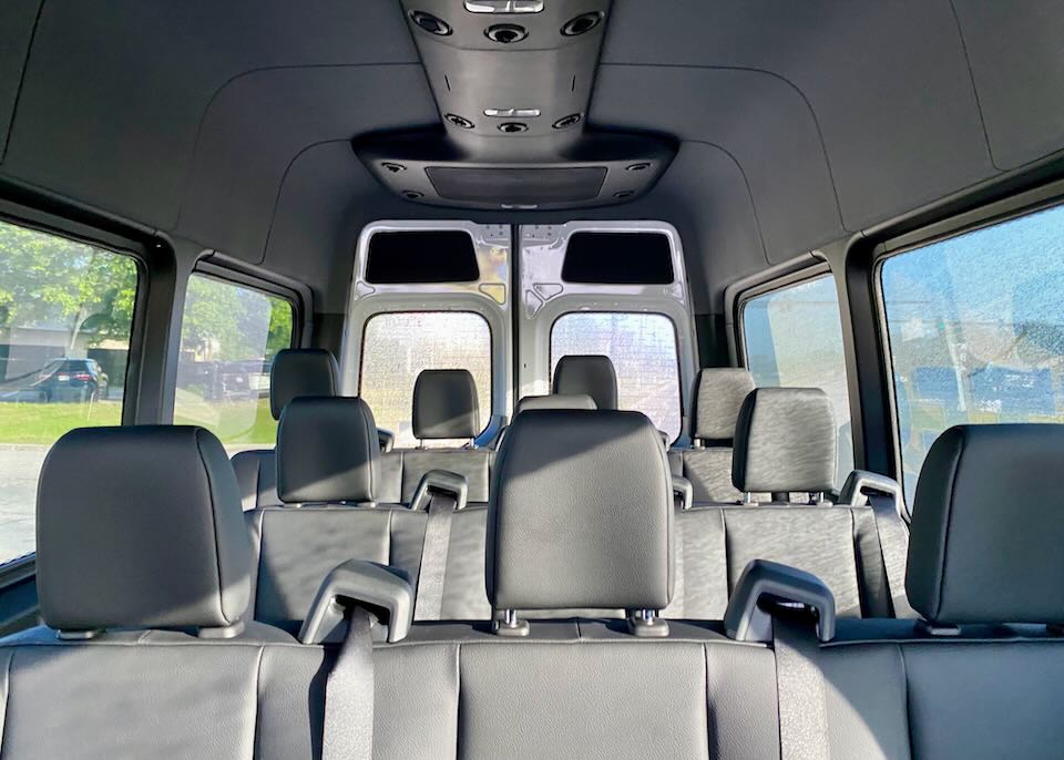 Inside the shuttle, there are three rows of passenger seats.