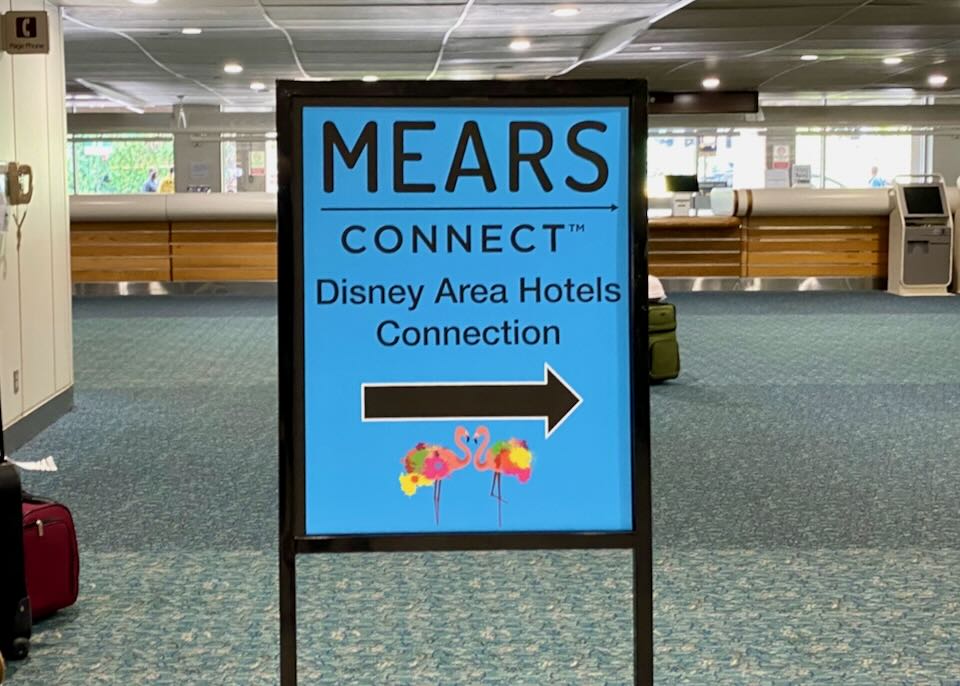 A blue MEARS Connect sign directs passengers to the right.