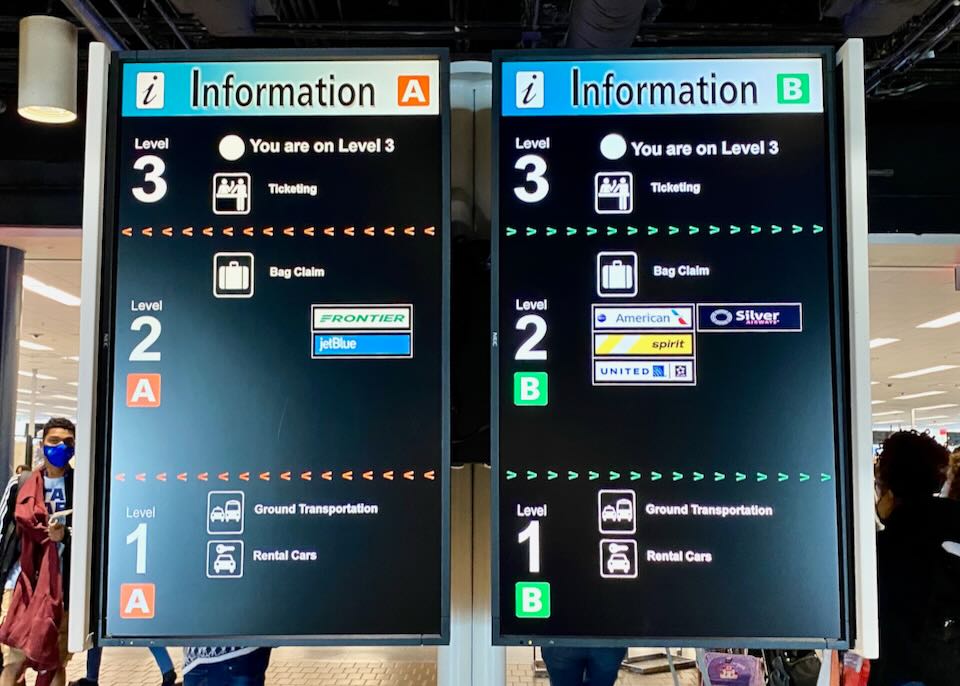 Two information signs show that baggage claim and rental cars are on level two.