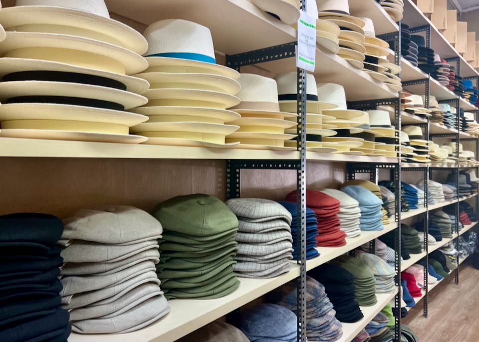 Shelf displays of stacked hats