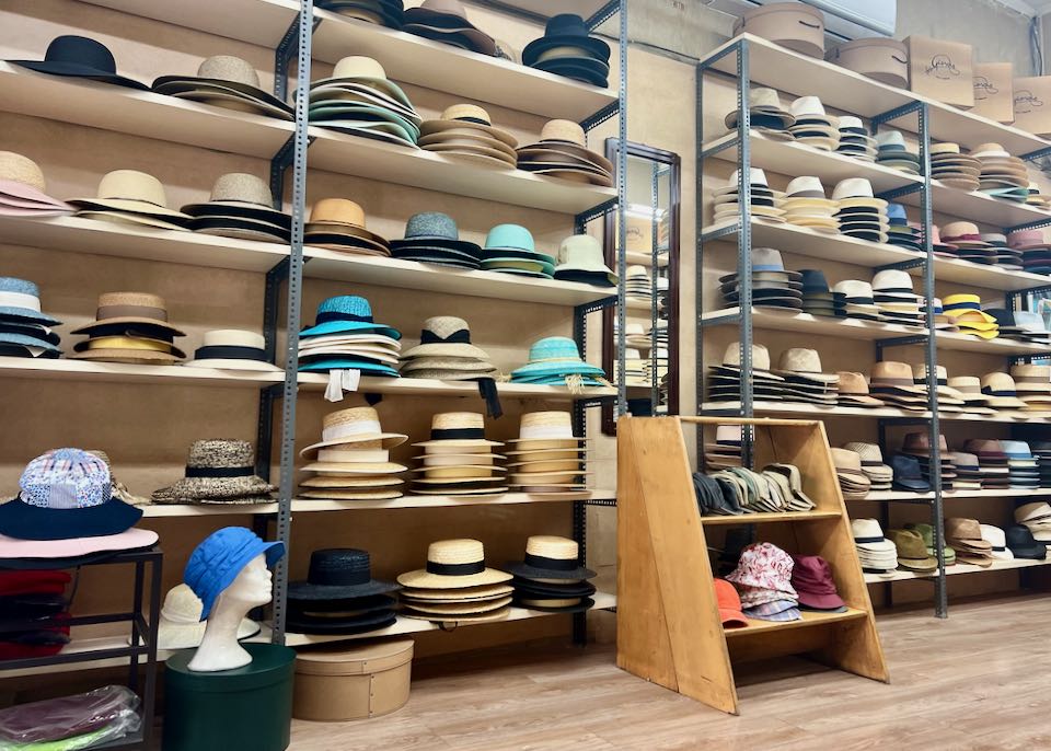 Ladies' hats displayed on a shelf