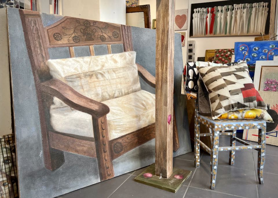 A painting of a traditional carved wooden chair