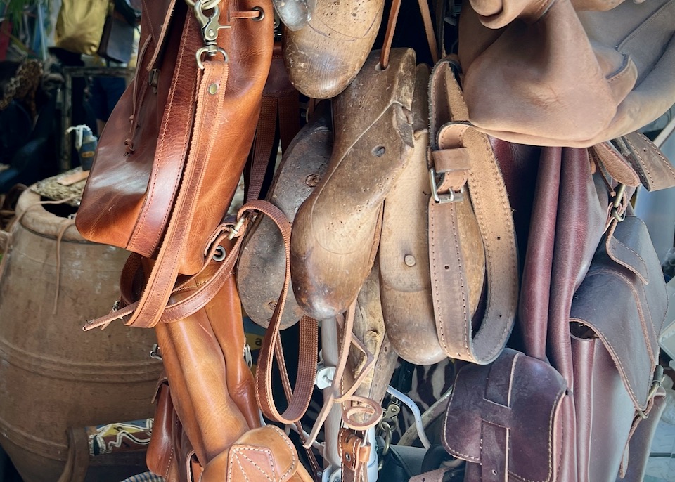 Leather bags hung in a shop display