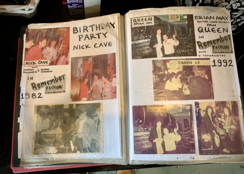 Open scrapbook showing photos of Nick Cave at a birthday party