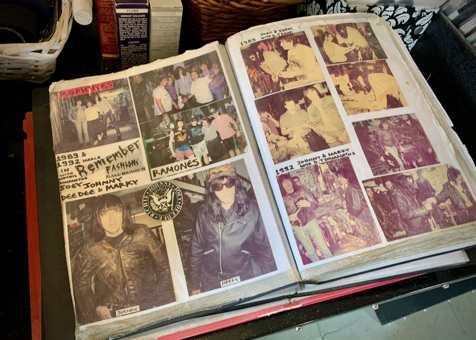 Photo album open to a page with photos of the band The Ramones