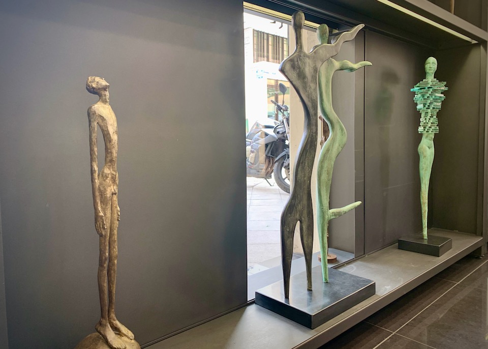 Metal sculptures displayed in a shop window