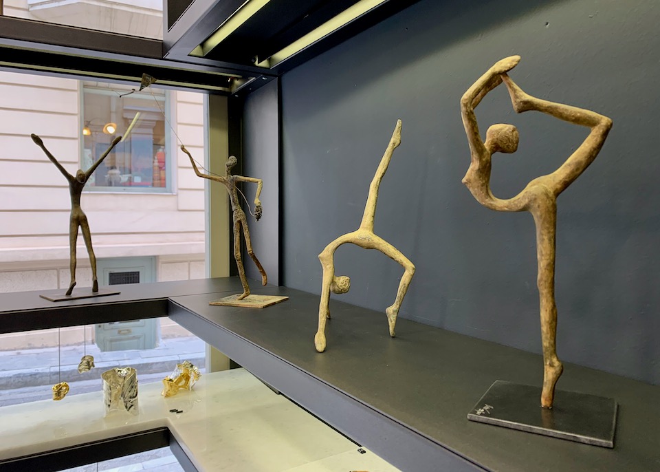 Metal sculptures of elongated human forms