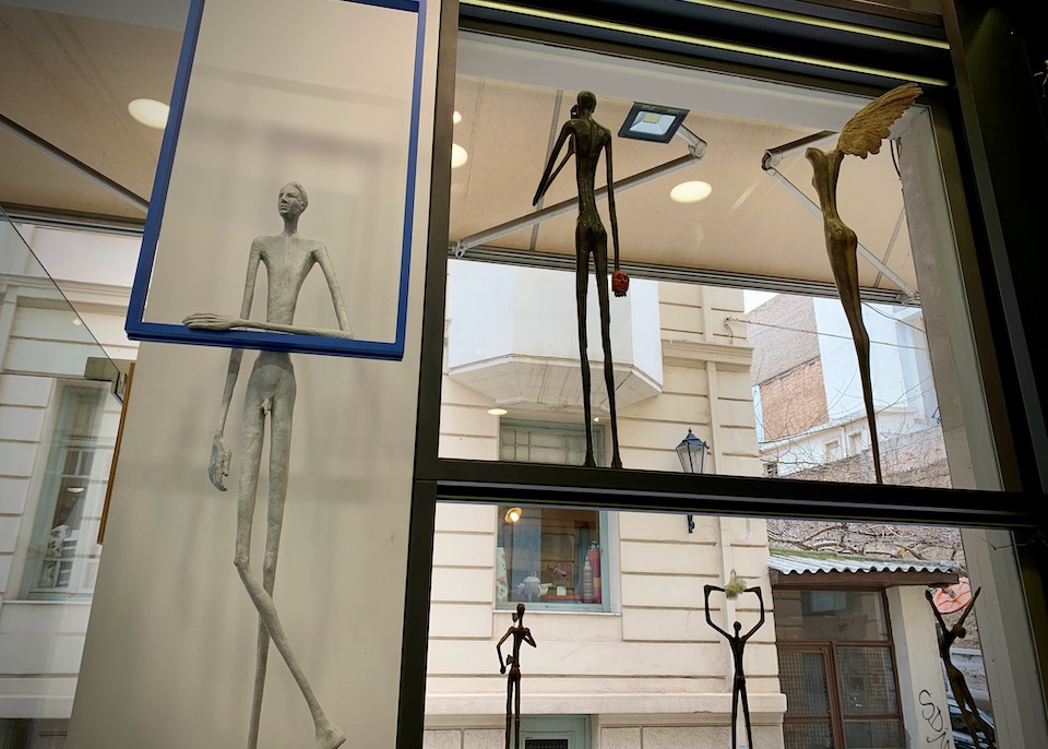 Metal sculptures displayed in a shop window