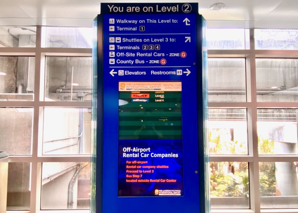 A blue sign directs people on level 2.