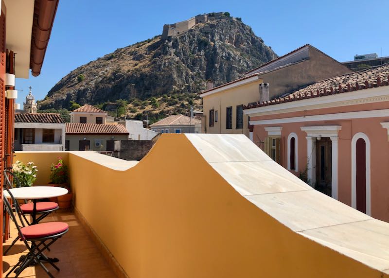 View of Palamidi castle from a furnished hotel balcony 