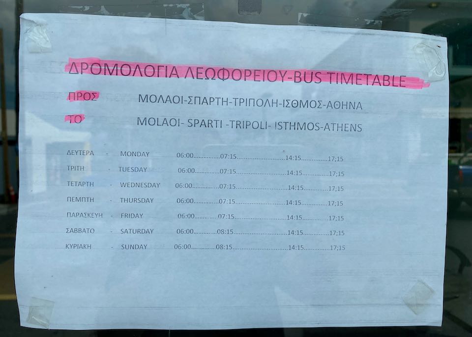 Bus schedule posted in a window.