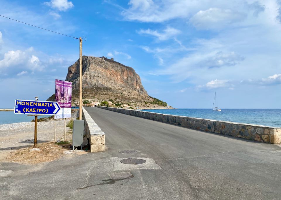 View of the Monemvasia causeway, with a sign pointing to Kastro
