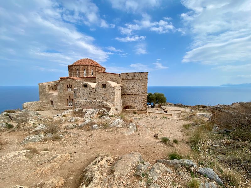 View of an old Byzantine church set high above the sea