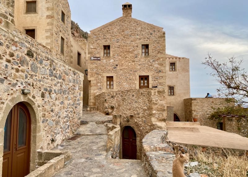 Old stone castle hotel with rounded wooden doorways