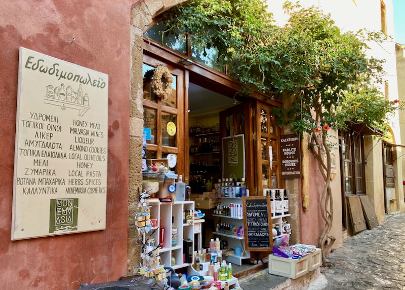 Rustic shop with a sign advertising food products of the southern Peloponnese