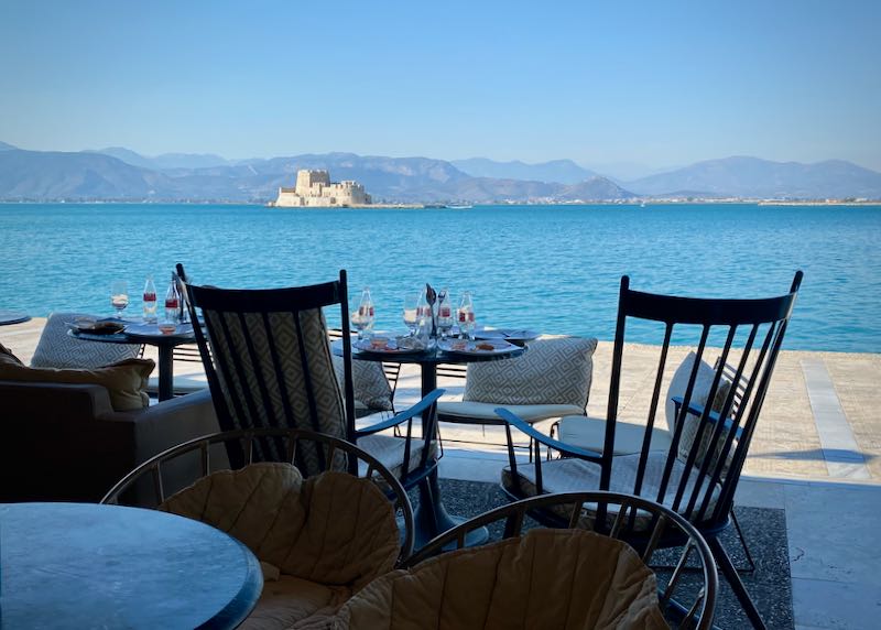 View of Bourtzi Castle from a waterfront cafe table in Nafplio