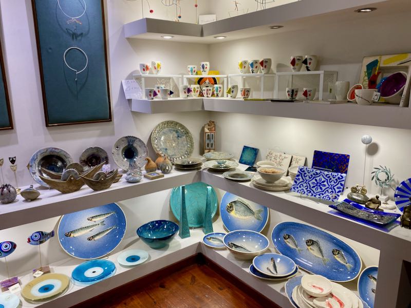 Store display of colorful ceramics and decorative art