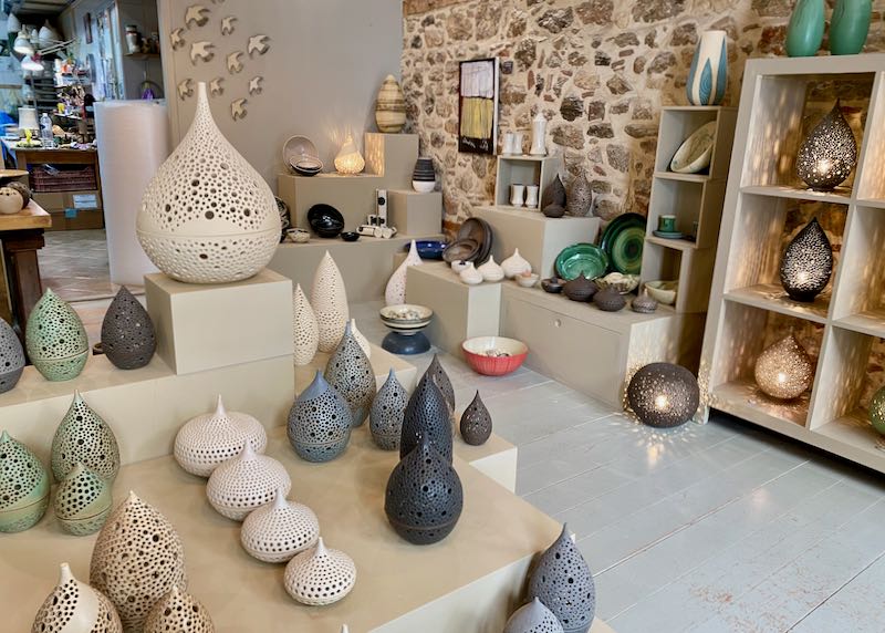 Store display with ceramic candleholders and tableware