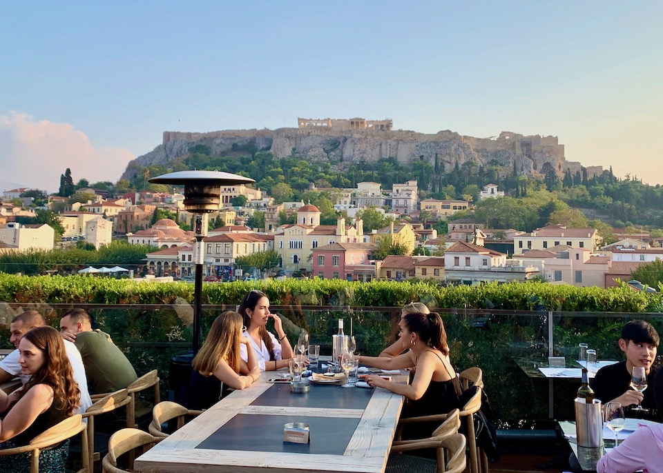 Wall Mural greek outdoor restaurant with Mediterranean sea view