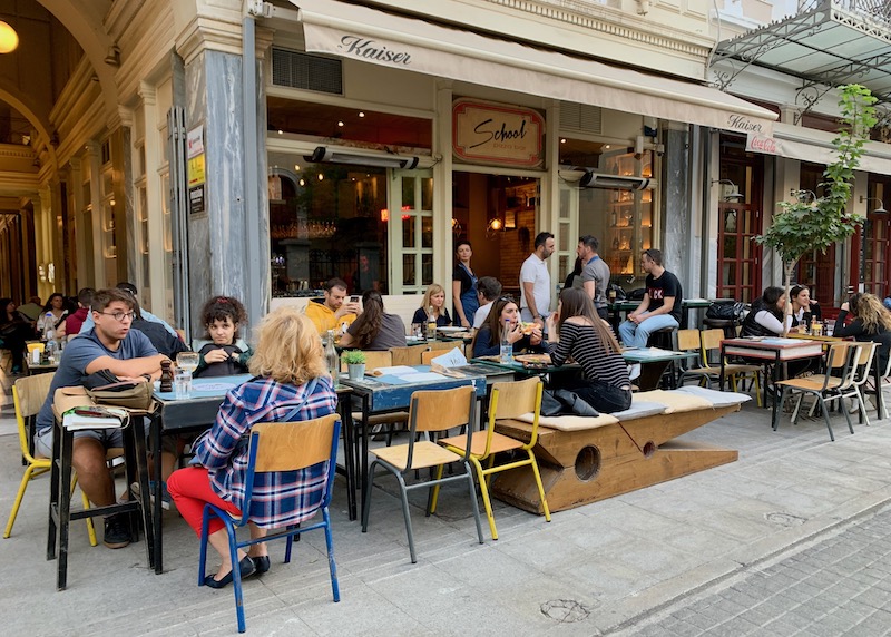 Sidewalk dining at School Pizza Bar in Monastiraki, Athens