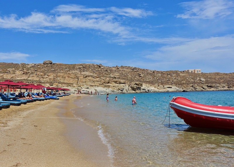 Sunbeds and a boat at Lia Beach in Mykonos