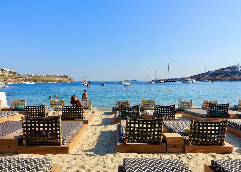 Sunbeds on Ornos Beach at Pasaji beach club and restaurant in Mykonos