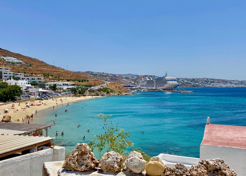 View over Agios Stefanos Beach toward the ferry port in Mykonos