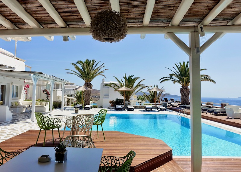 The pool and restaurant at Anemoessa Hotel in Kalafatis, Mykonos