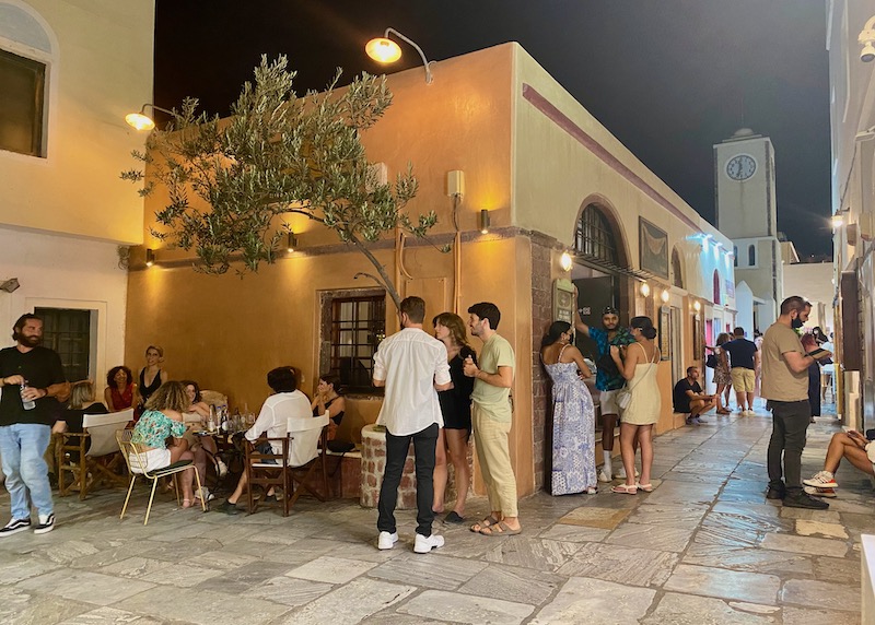 A small crowd in front of Marykay's Bar in Oia, Santorini