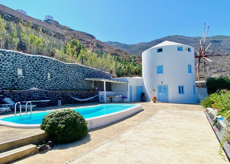 Private pool and exterior of the blue villa at Windmill Villas in Imerovigli, Santorini