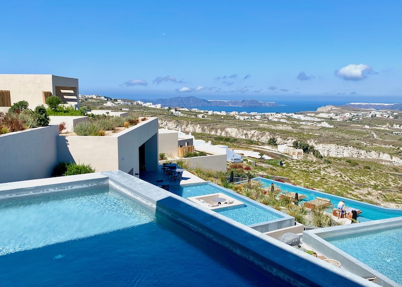 Pools arranged in tiers at North Villas in Pyrgos, Santorini with views toward the caldera