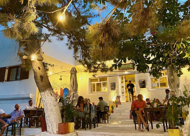 Tree shaded patio dining at Pentozali in Mesaria, Santorini